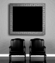 墙上的画框与两把椅子图片